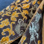Jaykco Orange and gold dragon on brown